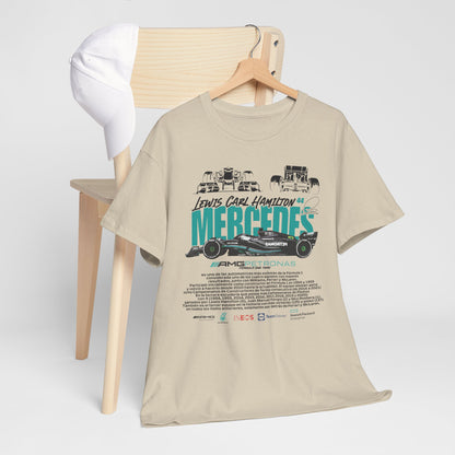 Elegant beige Mercedes F1 tribute tee featuring 'Lewis Carl Hamilton 44' design, displayed on a wooden chair alongside a white cap, emphasising sophisticated motorsport style.