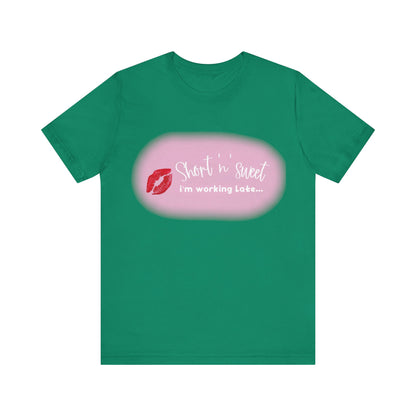 Sabrina Carpenter Inspired Unisex Short Sleeve Tee showcasing a vibrant lipstick print on a rich teal shade, a statement piece for stylish wardrobes.