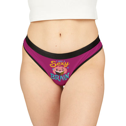 Elegant graphic thong showcasing playful design, featuring the message 'I Have a Sexy Brain' in vibrant colours on a luxurious magenta background. Perfect for adding a cheeky twist to intimate wear.