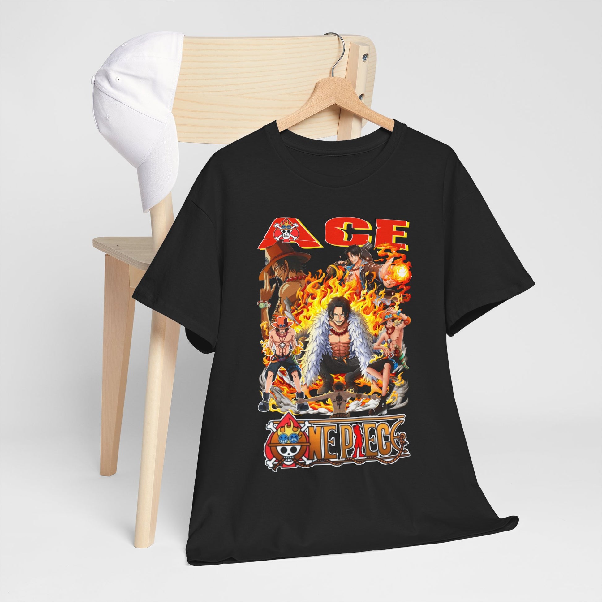 Luxurious men's black t-shirt featuring a vibrant Ace graphic from One Piece surrounded by flames, hung elegantly on a wooden chair with a matching white cap.