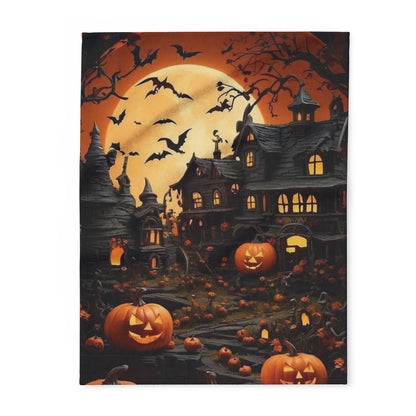 Luxurious Decorative and Warm Halloween Spooky Arctic Fleece Blanket featuring a haunting scene with a moonlit sky, silhouetted bats, and grinning jack-o'-lanterns, perfect for adding elegance to your Halloween decor.