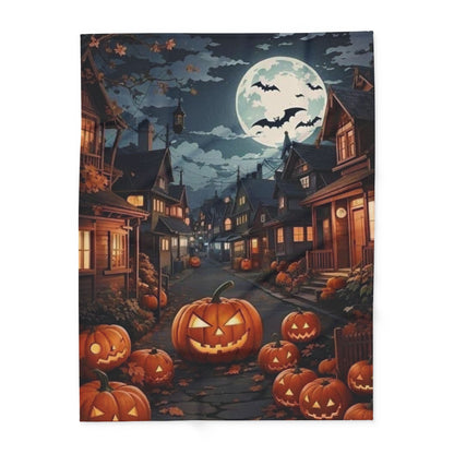 Decorative and Warm Halloween Spooky Arctic Fleece Blanket displayed in a picturesque street adorned with pumpkins under a full moon, perfect for adding a luxurious touch to your Halloween decor.