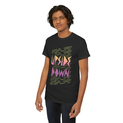 Stylish unisex graphic t-shirt featuring the text 'UPSIDE DOWN' in vibrant hues of pink and purple against a black background, perfect for fans of retro aesthetics.