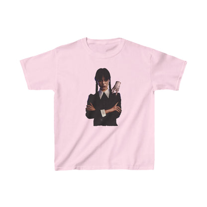 Luxury unisex graphic tee featuring Wednesday Addams with her companion Thing, designed for kids. Elegant pink background with striking imagery.