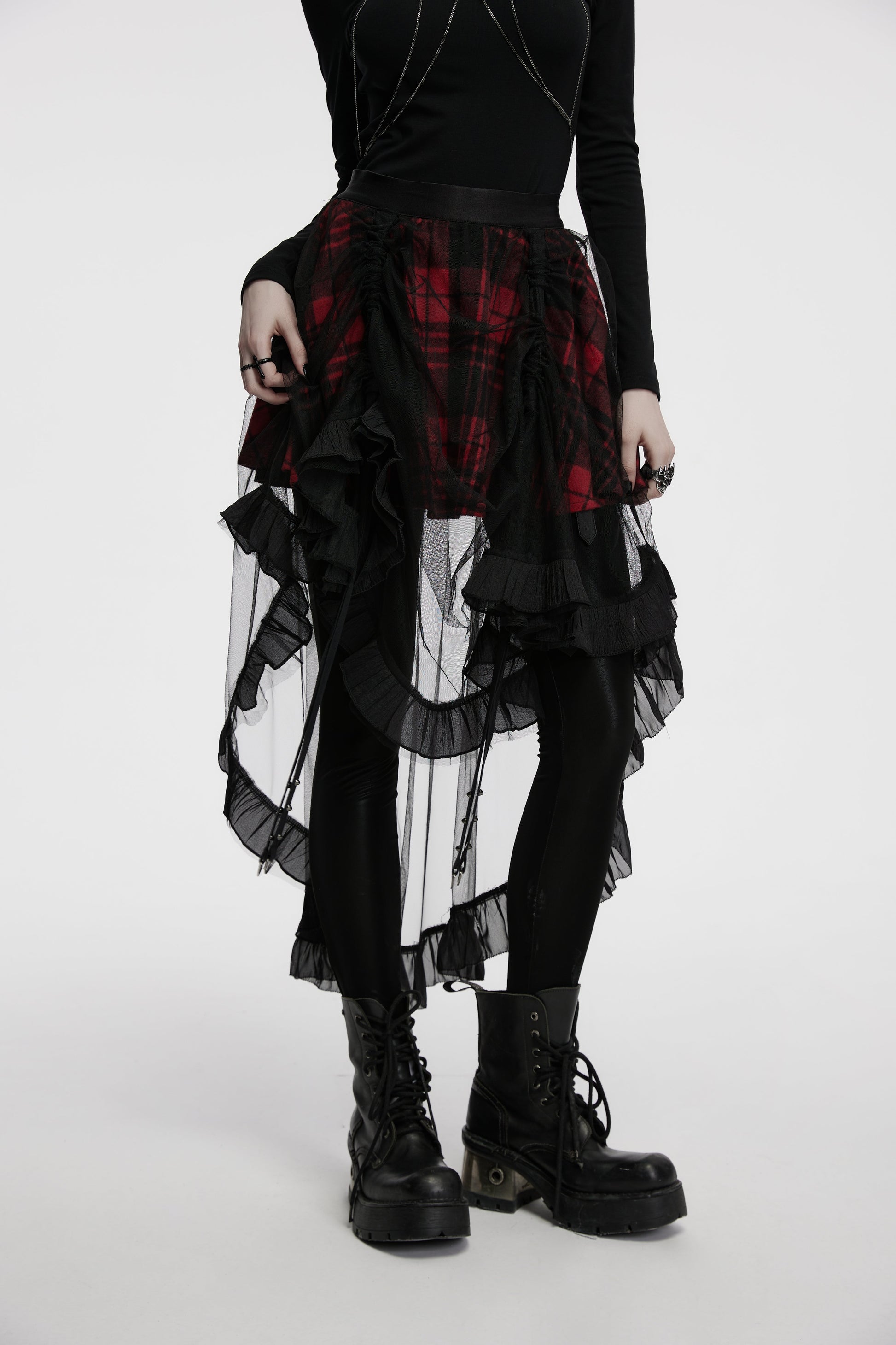 Punk Rave Morrigan High-Low Skirt showcasing bold red plaid fabric against sheer black mesh, epitomising alternative luxury fashion.