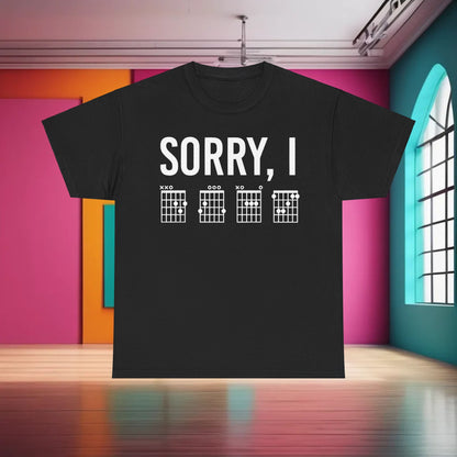 Make a statement with the Sorry I DGAF Graphic T-Shirt, displayed on a dark backdrop illustrating its bold chord graphics, ideal for creative expression.
