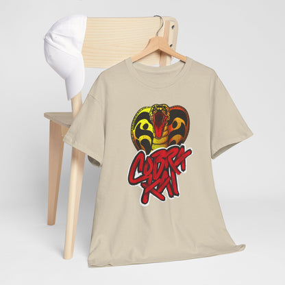 Fashionable Cobra Kai T-shirt arranged on a stylish wooden chair with a cap, embodying a luxurious casual look for martial arts aficionados.