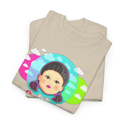 Neatly folded 'Squid Game' Unisex T-Shirt in beige, featuring a vibrant graphic of a character surrounded by colourful clouds, ideal for fans of trendy fashion.