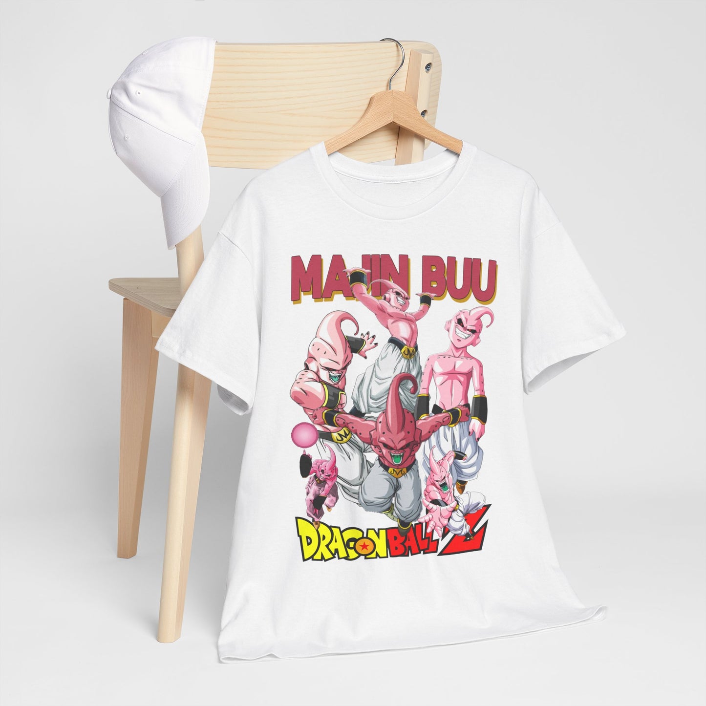 Elegant white T-shirt styled with a captivating Majin Buu design from Dragon Ball Z, positioned alongside a chic white cap, embodying contemporary anime streetwear.