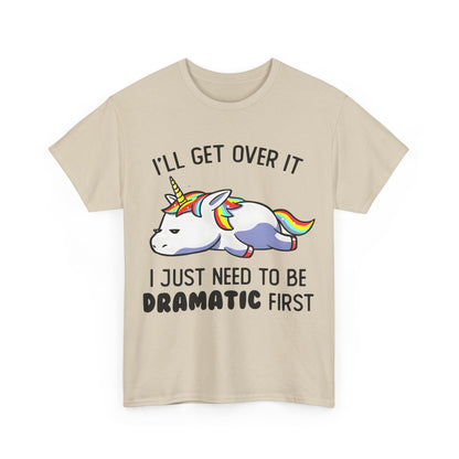 Unicorn Melancholy Graphic Tee in beige, highlighting a whimsical cartoon unicorn with a vibrant mane and the playful slogan 'I'LL GET OVER IT I JUST NEED TO BE DRAMATIC FIRST'.