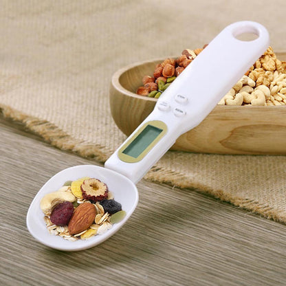 LCD kitchen scale weighing a mix of dried fruits and nuts, showcasing the precision of the LCD Digital Kitchen Scale Electronic Cooking Food Weight Measuring Spoon Grams Coffee Tea Sugar Spoon Scale Kitchen Tools.