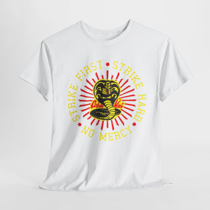 Luxury unisex graphic t-shirt featuring a striking Cobra Kai design with the phrase 'Strike First, Strike Hard, No Mercy' on a crisp white background, embodying the spirit of martial arts with a modern aesthetic.