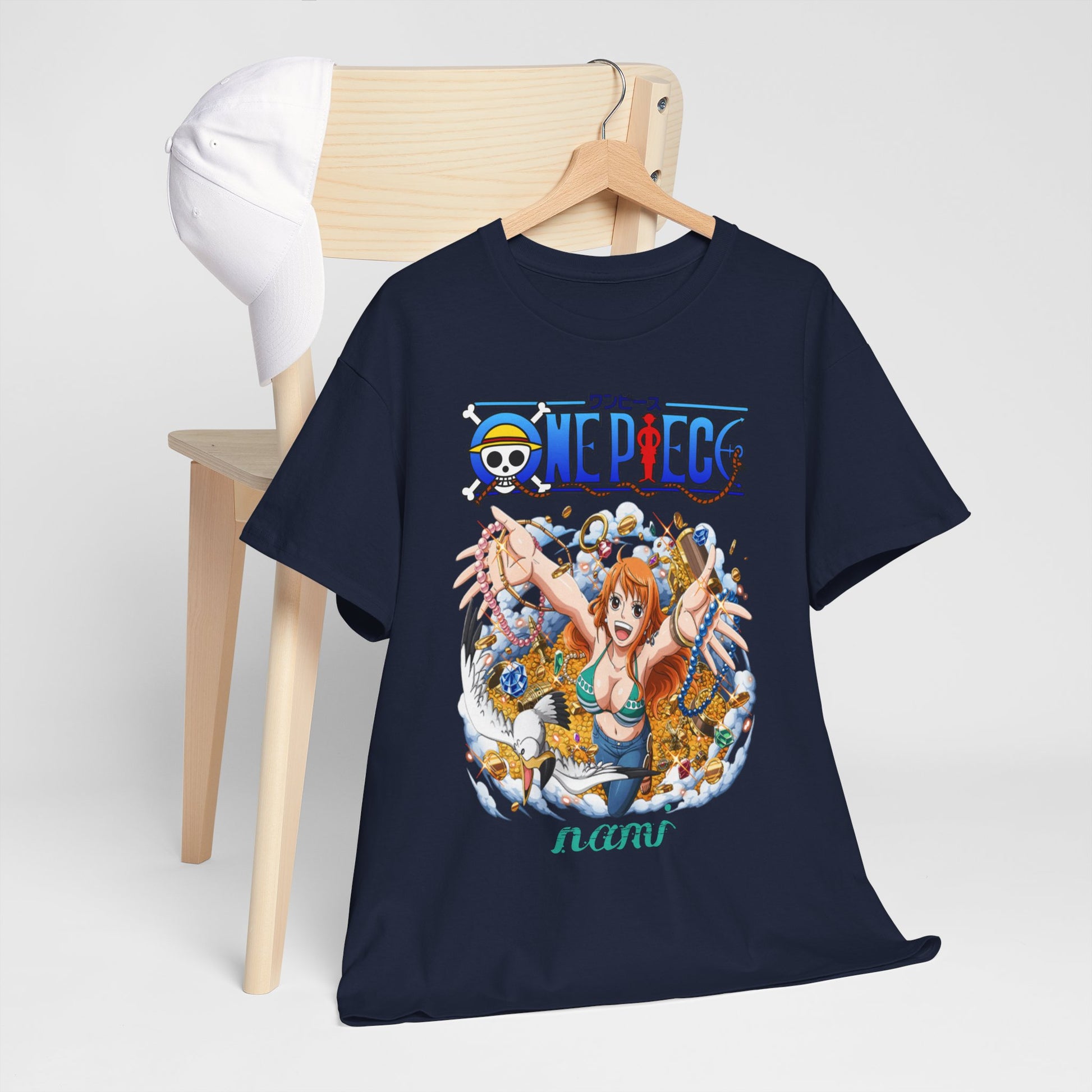 Stylish navy blue t-shirt displayed on a chic wooden chair, showcasing a detailed illustration of Nami from One Piece, embracing the spirit of adventure amidst glimmering treasures.