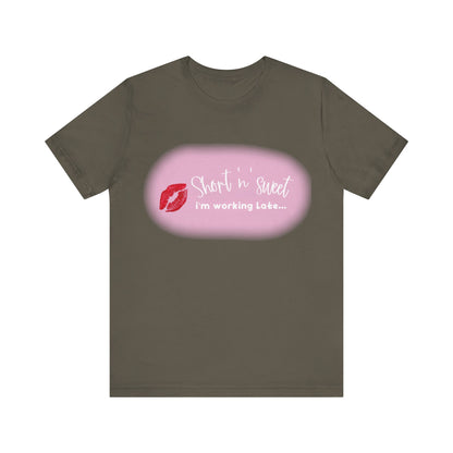 Sabrina Carpenter Inspired Unisex Short Sleeve Tee in sophisticated dark brown, adorned with a bold lipstick print and the phrase 'Short n sweet, i'm working Late...' for a stylish statement.