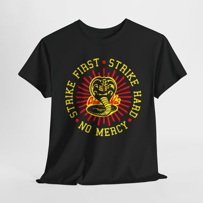 Elegant Cobra Kai graphic T-shirt featuring the iconic Cobra logo with the motto 'Strike First, Strike Hard, No Mercy' in vibrant yellow and red on a luxurious black cotton fabric. This unisex tee combines style and humour, perfect for martial arts enthusiasts and fans of the legendary series.