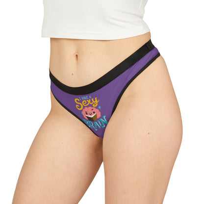 Stylish purple women's thong worn on a model, featuring a vibrant 'I Have a Sexy Brain' graphic, blending luxury with playful charm.