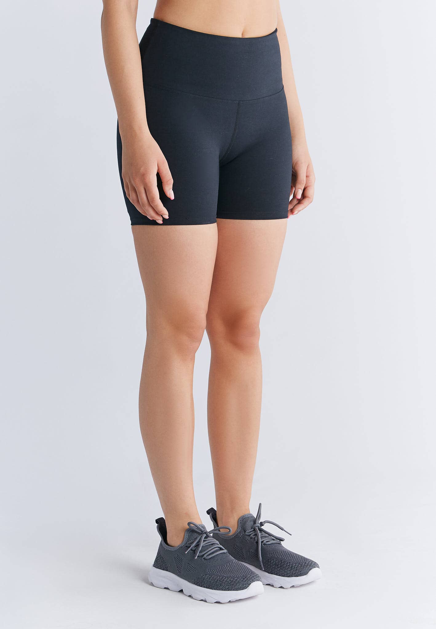 Luxury eco-friendly organic cotton mini sports shorts for women, featuring a high waistband for ultimate comfort and style.