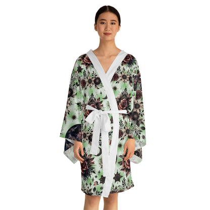 Woman elegantly wearing the Floral Kimono Robe, accented by a chic waist tie, epitomising luxury loungewear.