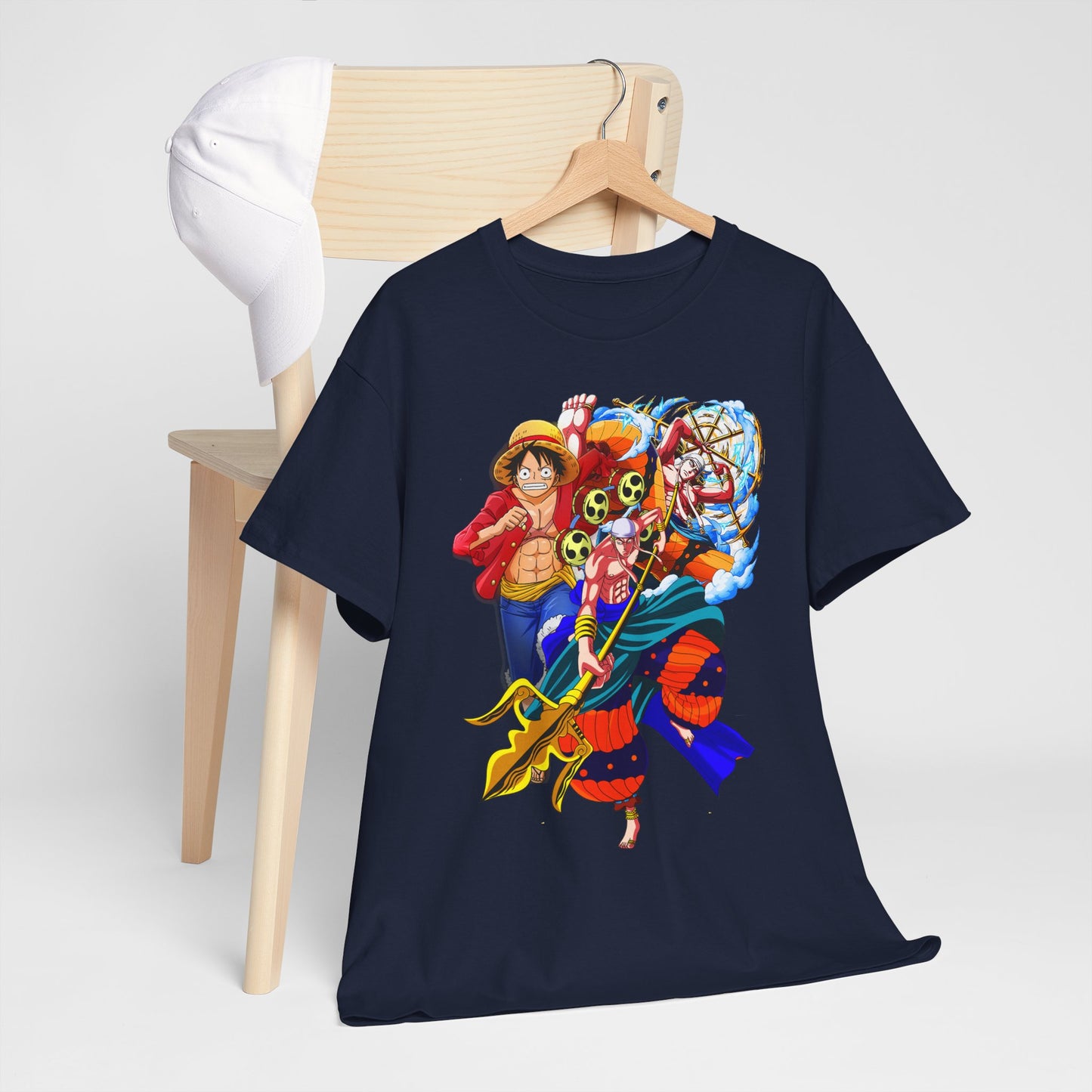 Sophisticated navy t-shirt with striking anime graphics, artistically arranged with a cap on a chair, embodying unique fashion flair.