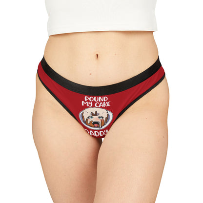 Luxurious red women's thong featuring a humorous graphic design with the phrase 'POUND MY CAKE' and a playful cake illustration, perfect for cheeky romantic occasions.