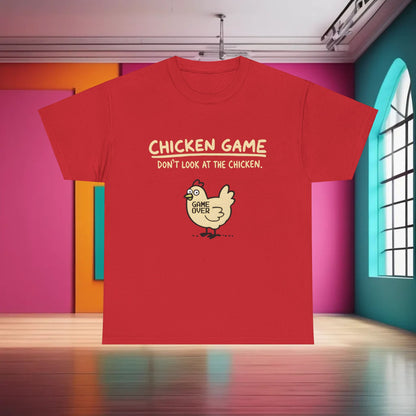 Urban Chicken Game Graphic T-Shirt in vibrant red, featuring playful chicken design and text ‘CHICKEN GAME, DON’T LOOK AT THE CHICKEN.’ Embrace unique style with 100% cotton unisex casual wear.