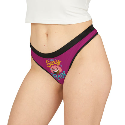 Sleek and sophisticated thong with playful branding, 'I Have a Sexy Brain', in a delightful magenta shade, embodying a luxurious yet cheeky essence suitable for special occasions.