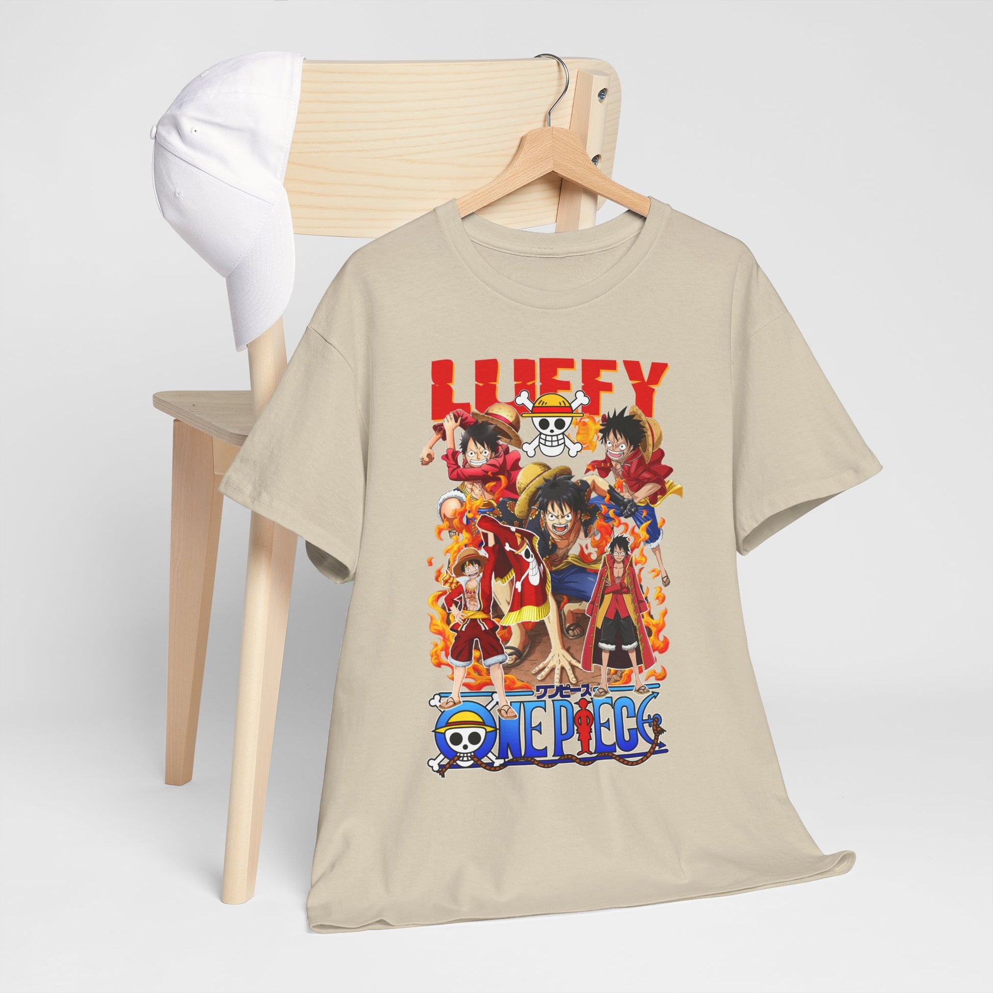 Chic One Piece themed t-shirt elegantly hung with a hat, styled on a minimalist chair, representing a perfect blend of comfort and luxury for anime lovers.
