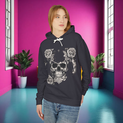Unisex Lightweight Hooded Sweatshirt with a striking designer skull and roses design, worn by a model in a stylish dark shade, set in an elegant room with bright pink walls, exemplifying luxury street fashion.