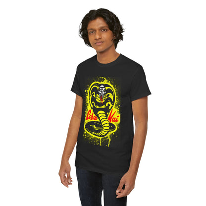 Trendy unisex Cobra Kai T-shirt displayed on a male model, featuring bold cobra artwork in vibrant yellow, perfect for fans of martial arts humour and nostalgia.
