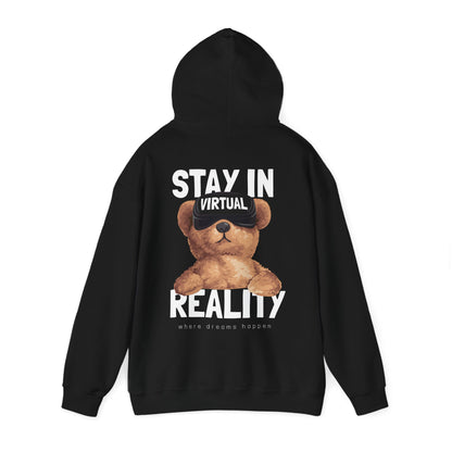 Chic black hoodie featuring an adorable teddy bear graphic wearing VR goggles, enhanced by the captivating phrases 'STAY IN VIRTUAL REALITY' and 'where dreams happen,' presented in a bold, luxury style.