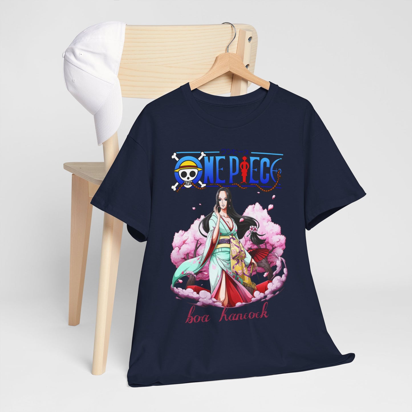 Chic visual of a navy blue t-shirt featuring a stunning graphic of Boa Hancock from 'One Piece', elegantly draped over a wooden hanger, symbolising refined anime fashion.