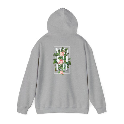 Impeccably styled grey hoodie showcasing a floral back print that spells out 'MOTHER' in bold typography, adorned with delicate pink roses and lush green leaves, encapsulated in a refined square design.