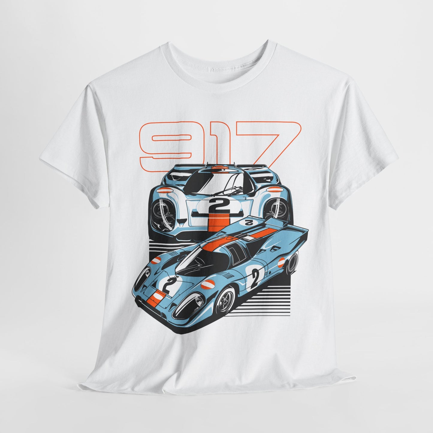 Luxurious white graphic t-shirt featuring an exquisite illustration of two iconic Porsche 917 race cars with light-blue designs and vibrant orange racing stripes, perfect for car enthusiasts.