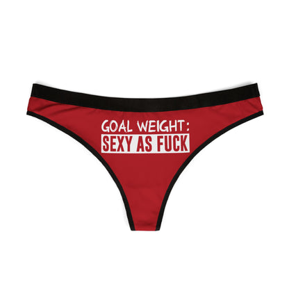 Chic red women's thong with black elastic waistband, showcasing playful text: 'GOAL WEIGHT: SEXY AS FUCK', perfect for adding a touch of fun to intimate wear.