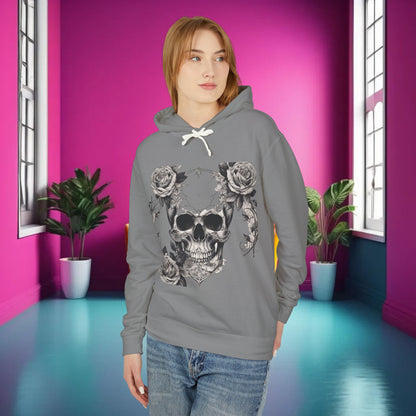 Model presenting the stylish Unisex Lightweight Hooded Sweatshirt in a light grey colour, featuring a striking skull and roses design, set against an artistic backdrop.