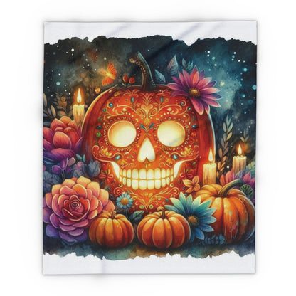 Elegant Decorative and Warm Halloween Spooky Arctic Fleece Blanket showcasing a beautifully styled orange skull amidst a floral arrangement, perfect for upscale Halloween decor.