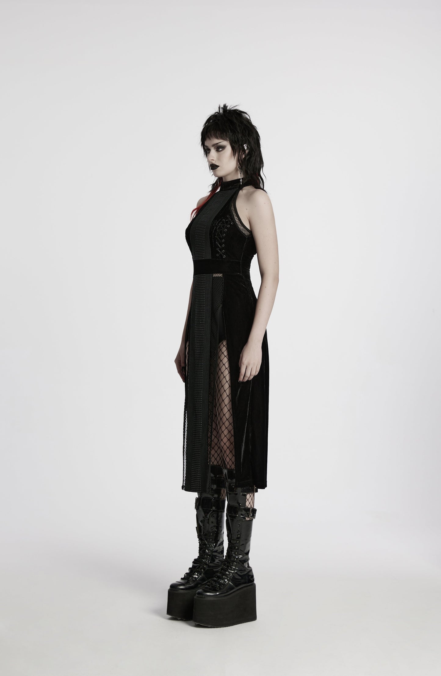 Dramatic thigh-high slit of the Punk Rave Selene black goth dress highlighting seductive elegance and sophisticated style.