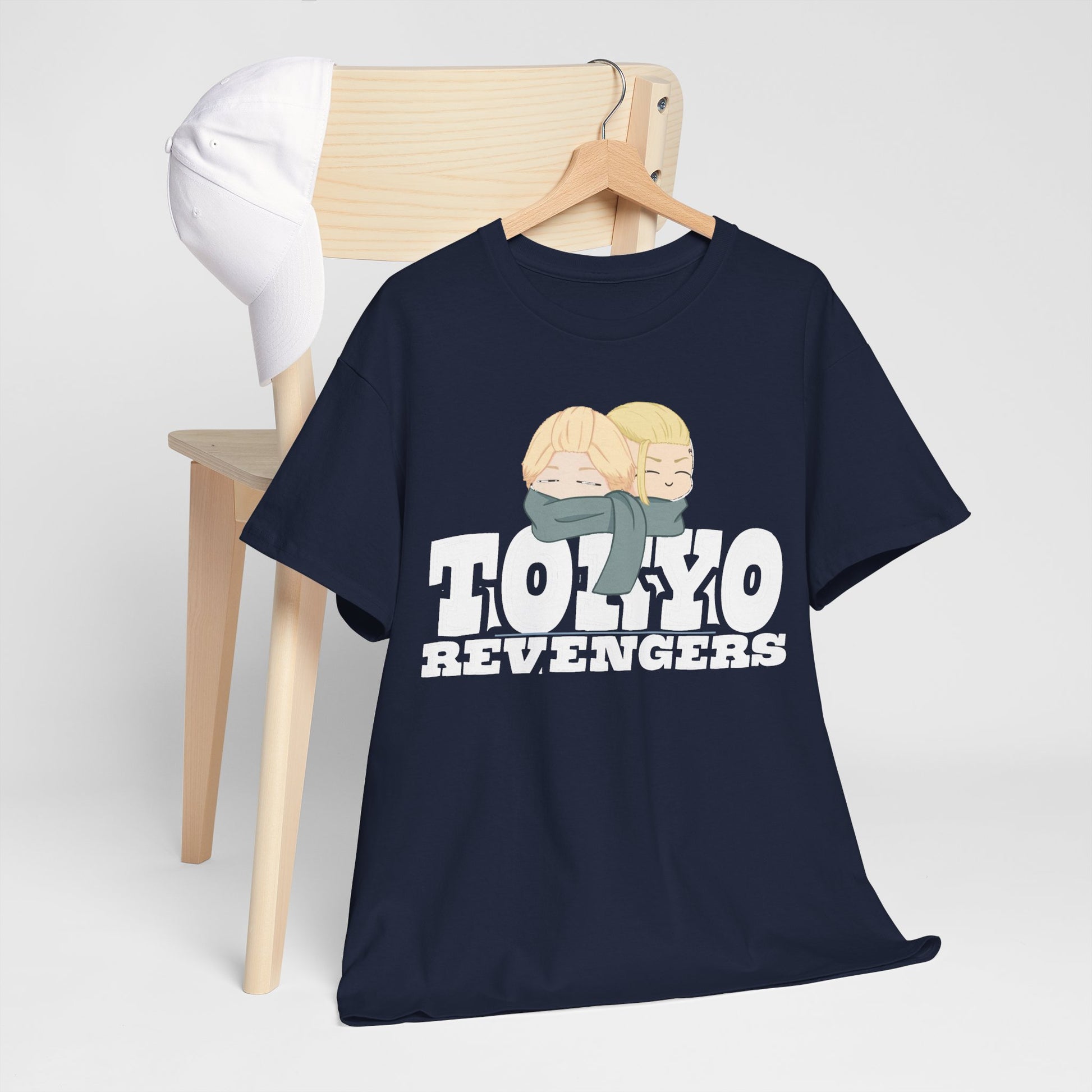 Stylish Tokyo Revengers graphic t-shirt draped over a chic chair, featuring cute anime characters and bold text, an ideal choice for fashion-forward anime fans.
