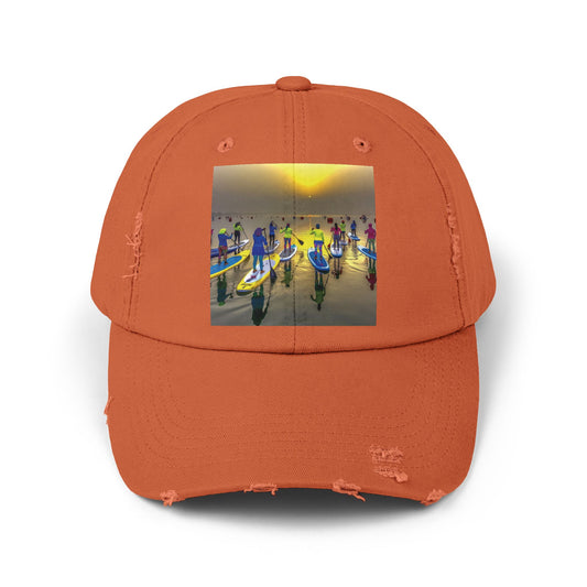 Unisex Distressed Paddleboarders Cap in vibrant orange, showcasing a stunning paddleboarding scene, perfect for stylish sun protection during luxury water adventures.