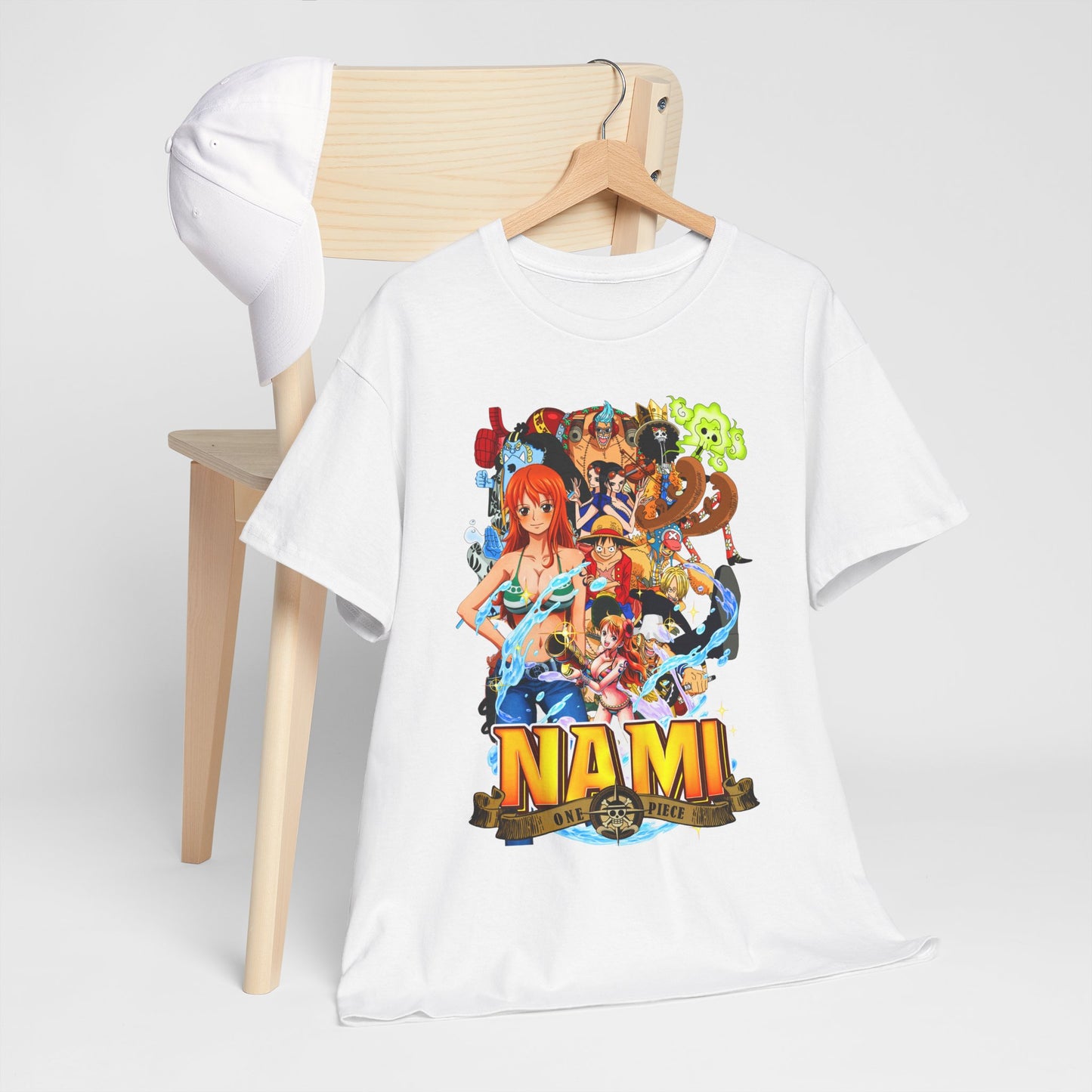 Sophisticated arrangement of a white Nami graphic t-shirt paired with a modern cap on a minimalist chair, embodying a trendy yet luxurious lifestyle.