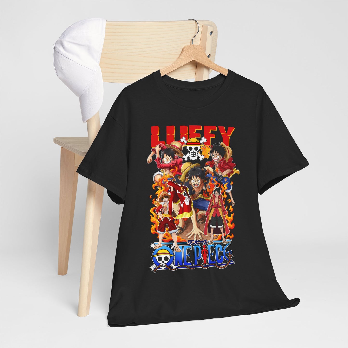 Luxurious black t-shirt featuring a vibrant anime design with iconic action-packed characters, showcasing exquisite detail on a sleek wooden hanger, complemented by a stylish white cap.