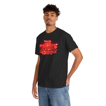Chic male model showcasing a black graphic t-shirt with 'THE UPSIDE DOWN' design in vibrant red, perfect for fashion-forward enthusiasts of the supernatural.