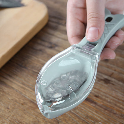 Close-up of a Fish Skin Brush in hand, expertly catching fish scales, embodying luxury and efficiency in kitchen tools.