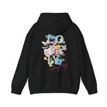 Chic black hoodie adorned with a stunning floral design on the back, displaying 'LOVELY' in striking dark-grey typography, surrounded by cheerful pink roses, blue flowers, and charming butterflies, ideal for fashionable everyday outfits.