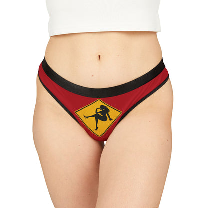 Elegant women's thong featuring a vibrant red background and playful yellow caution sign design, perfect for cheeky Valentine's gifts and romantic occasions.