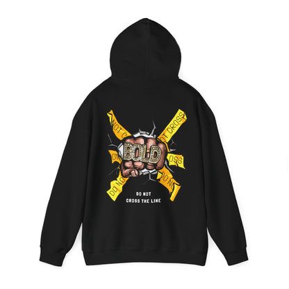 Elegant black hoodie with an eye-catching back graphic of a fist adorned with diamonds against a backdrop of bright yellow caution banners proclaiming 'DO NOT CROSS THE LINE'.