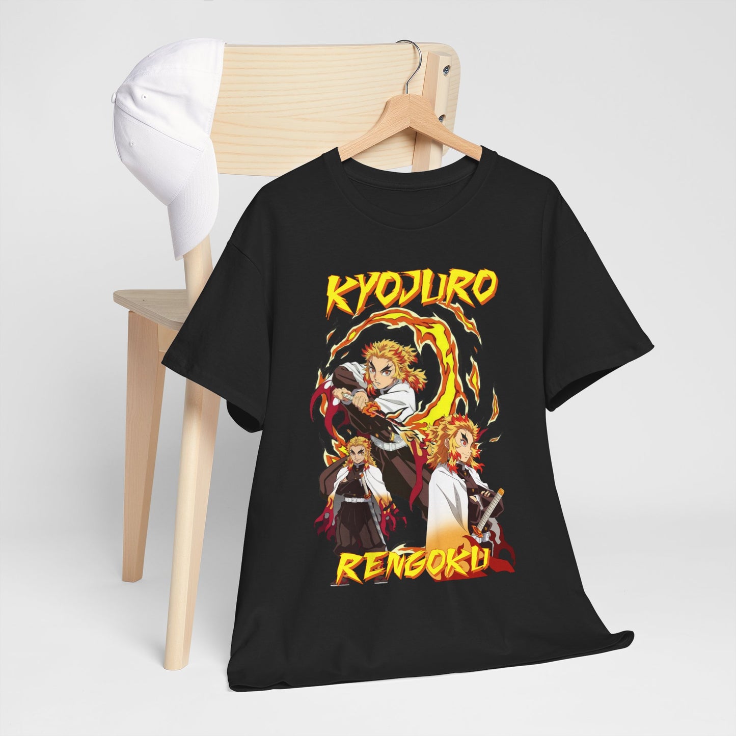 Chic black t-shirt draped over a wooden chair, featuring an artistic representation of Kyojuro Rengoku with striking flames, embodying modern streetwear for anime aficionados.