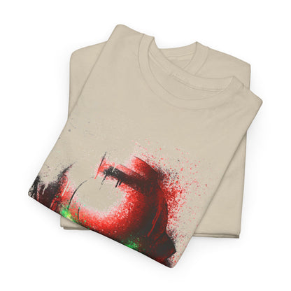 Tastefully folded beige t-shirts displaying a captivating red and green helmet design with artistic ink splatters, reflecting a modern, trendy aesthetic.
