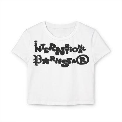 Chic white cropped baby T-shirt with a striking graphic design saying 'International Pornstar', offering a modern twist for fashionable outfits.