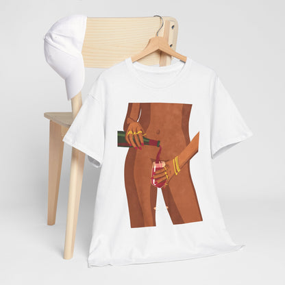 Vibrant Wine Glass Women's Graphic T-Shirt displayed with a cap and wooden chair, illustrating an elegant graphic of a woman pouring wine, merging art with contemporary fashion.